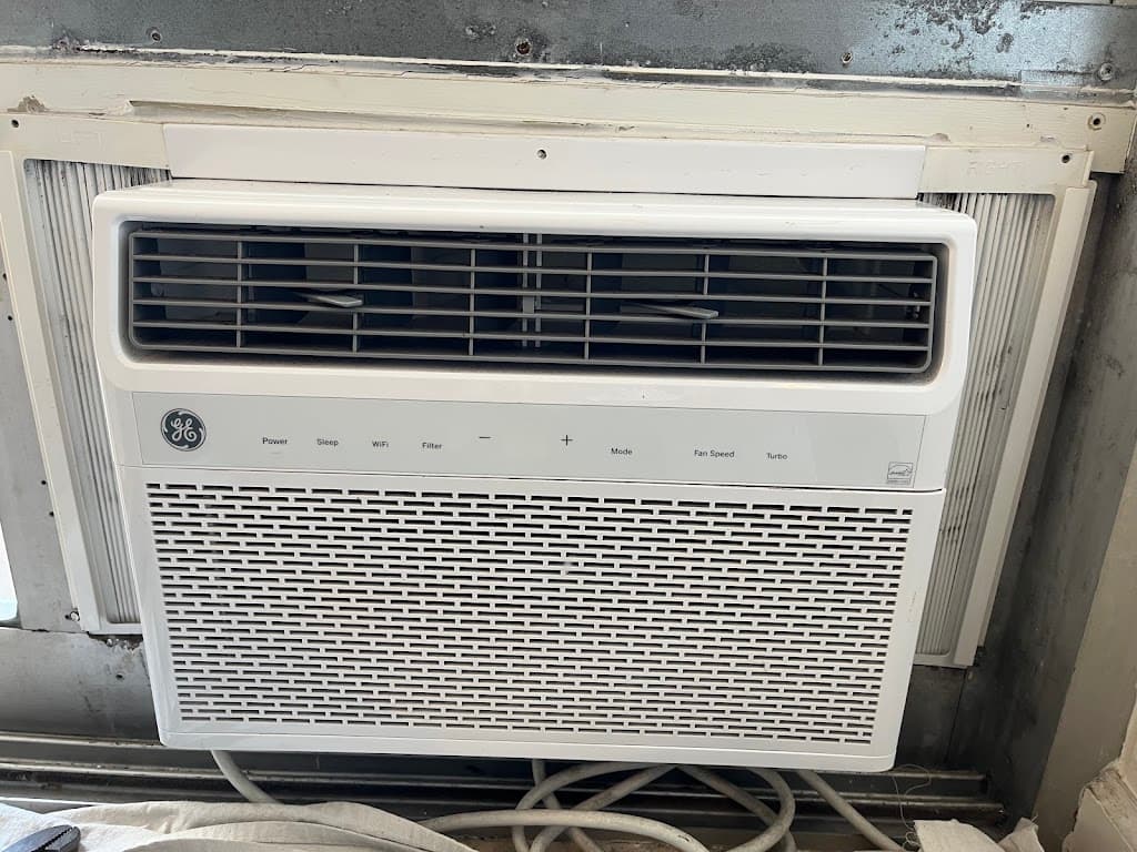 Finished window air conditioning unit installation with trim