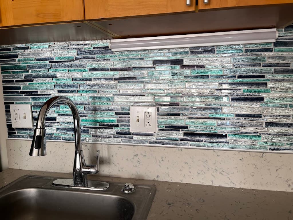 Finished kitchen sink and tile backsplash renovation